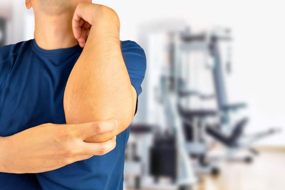 Achy elbow pain management by Dr. Burke Orthopedics for sports injuries and joint care.